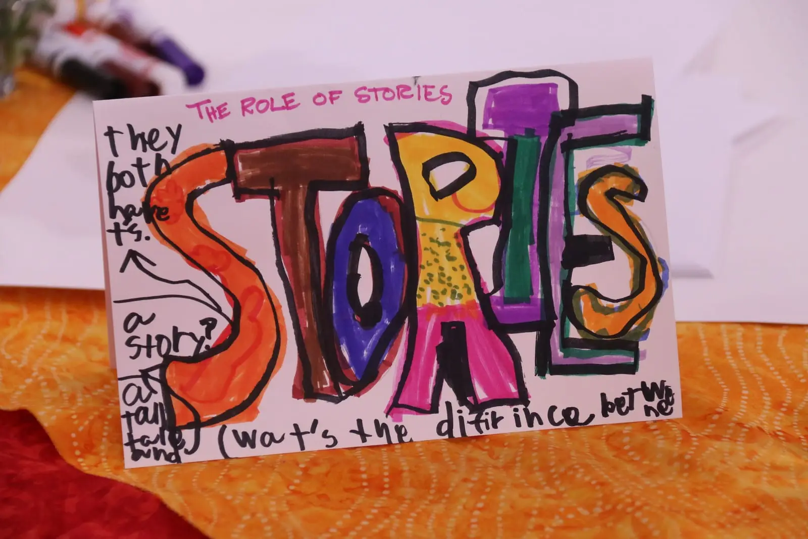 Hand-lettered artwork titled “Stories” in bright colors