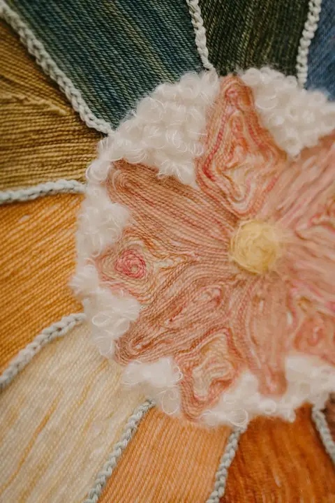 A close view of woven fibers in warm colors