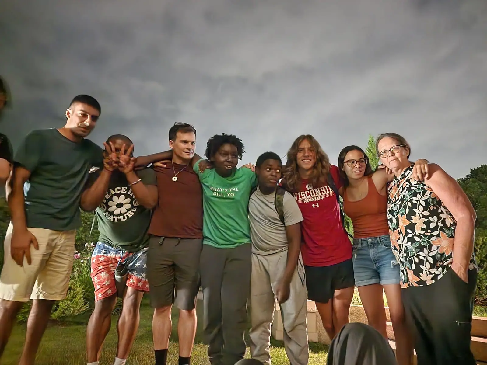 Young people standing together outdoors at a summer youth camp